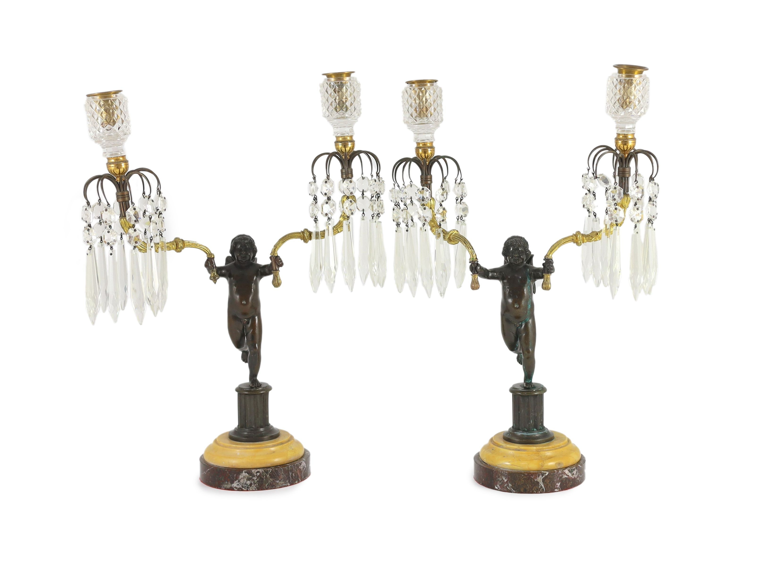 A pair of early 19th century bronze and ormolu figural candelabra, width 30cm, height 42cm